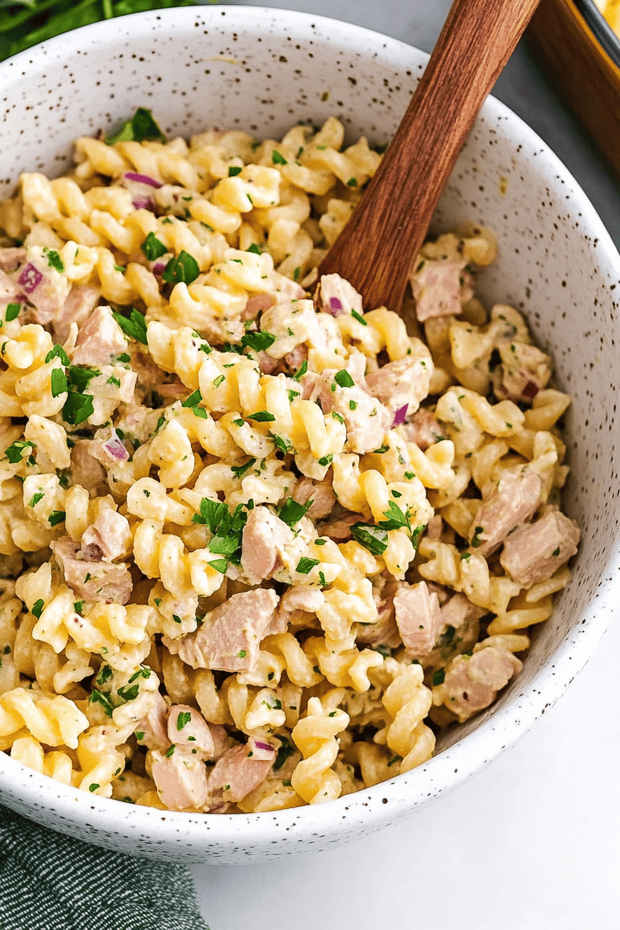 tuna pasta salad ingredients organized and measured on kitchen counter
